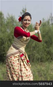 Woman performing Bihu dance