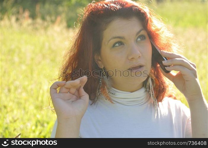 woman phoning in the nature. woman phoning