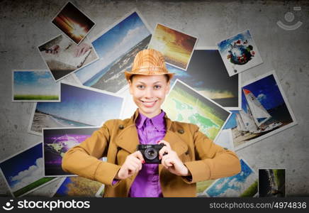Woman photographer. Young pretty woman with photo camera in hands