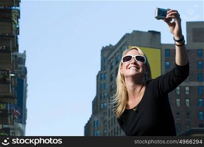 Woman photographing herself