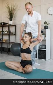 woman physiotherapy doing exercises with physiotherapist