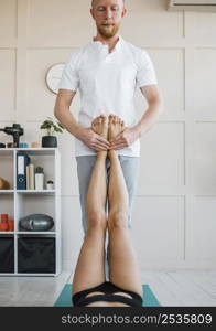 woman physiotherapy with male physiotherapist