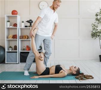 woman physiotherapy with physiotherapist