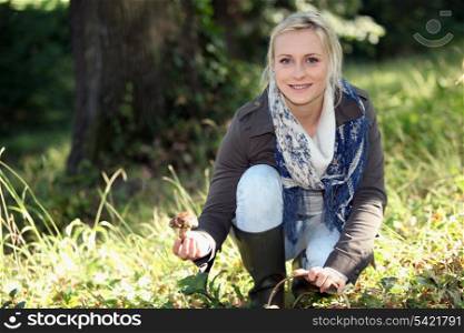 Woman picking mushrooms