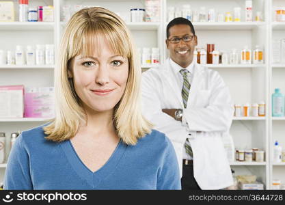 Woman picking up prescription drugs at pharmacy