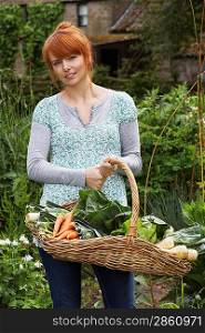 Woman Picking Vegetables in Garden