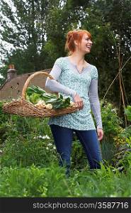 Woman Picking Vegetables in Garden