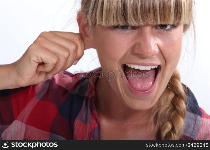 Woman pinching an ear