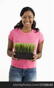 Woman pink top with plant
