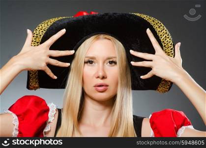 Woman pirate against grey background