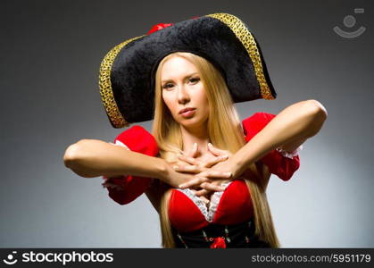 Woman pirate against grey background