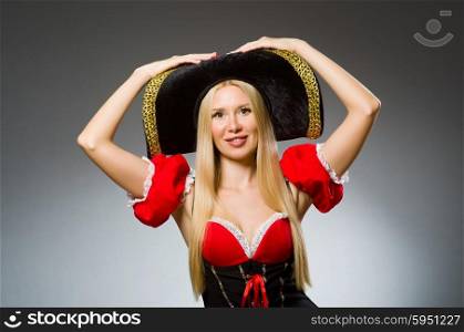 Woman pirate against grey background