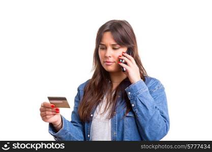 Woman placing an order at the phone with her credit card