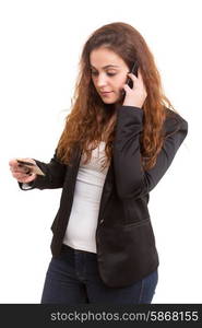 Woman placing an order at the phone with her credit card