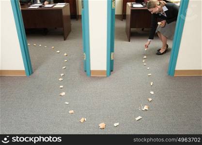 Woman placing trail of bread