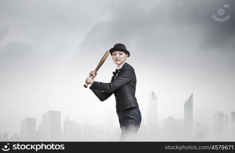 Woman play baseball. Young pretty woman in suit and hat with baseball bat