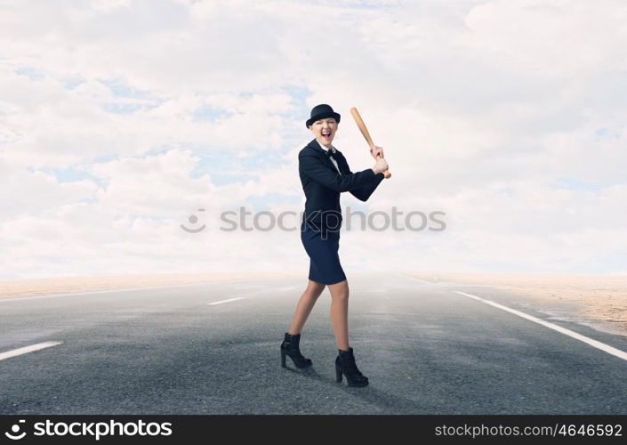 Woman play baseball. Young pretty woman in suit and hat with baseball bat