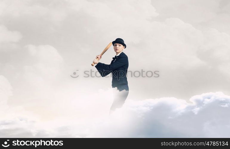 Woman play baseball. Young pretty woman in suit and hat with baseball bat