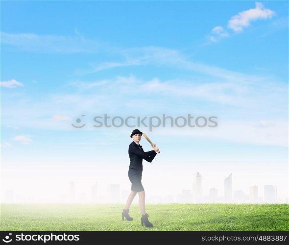 Woman play baseball. Young pretty woman in suit and hat with baseball bat