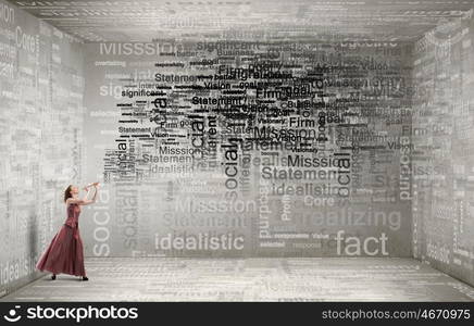 Woman play fife. Young woman in evening dress playing fife