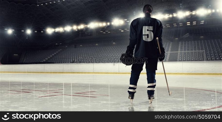 Woman play hockey mixed media. Woman ice hockey player during a game