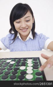 woman playing board game