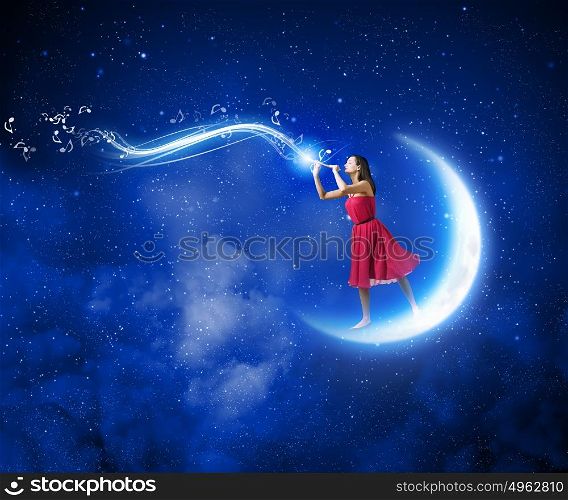 Woman playing fife. Young woman in red dress standing on moon and playing fife