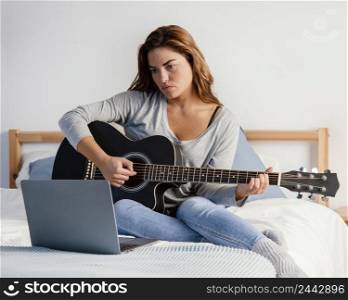 woman playing guitar streaming