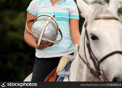 Woman playing horse ball