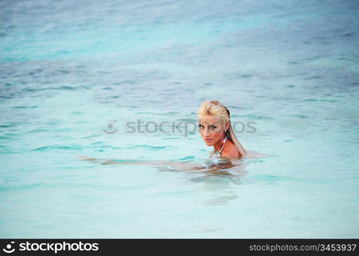 woman playing in ocean water