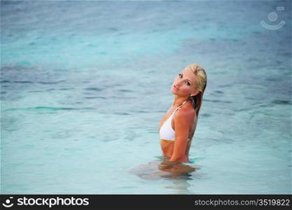 woman playing in ocean water