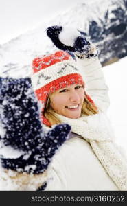 Woman playing in the snow