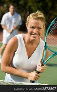 Woman Playing Tennis at Net