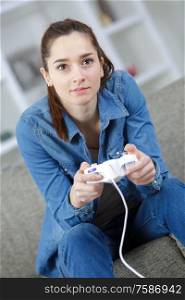 woman playing video game with controller