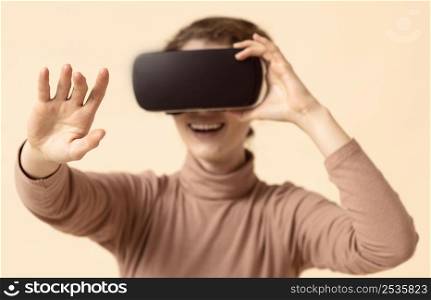 woman playing virtual reality headset reaching her arm