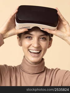 woman playing virtual reality headset smiles