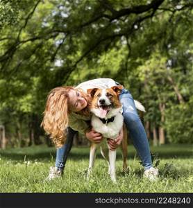 woman playing with her dog park