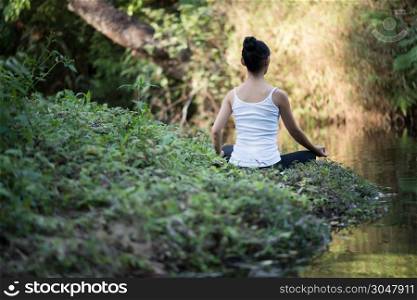 woman playing yoga garden field weekend holiday lifestyle park outdoor nature background.
