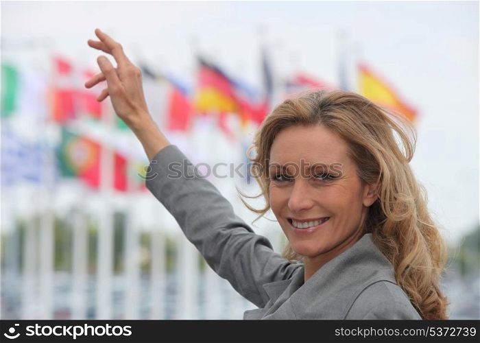 Woman pointing at flags