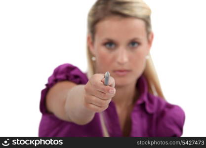 Woman pointing her pen at you