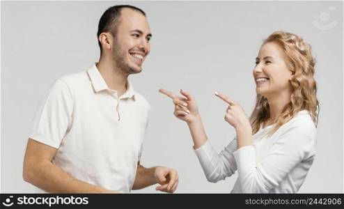 woman pointing man laughing