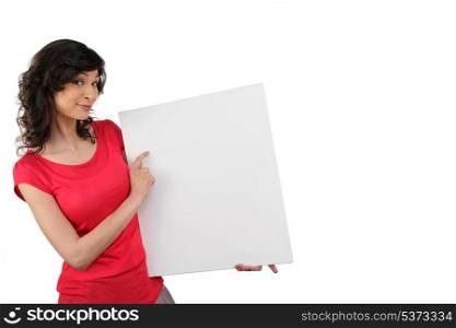 Woman pointing to a blank sign
