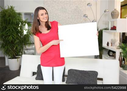 Woman pointing to a sign