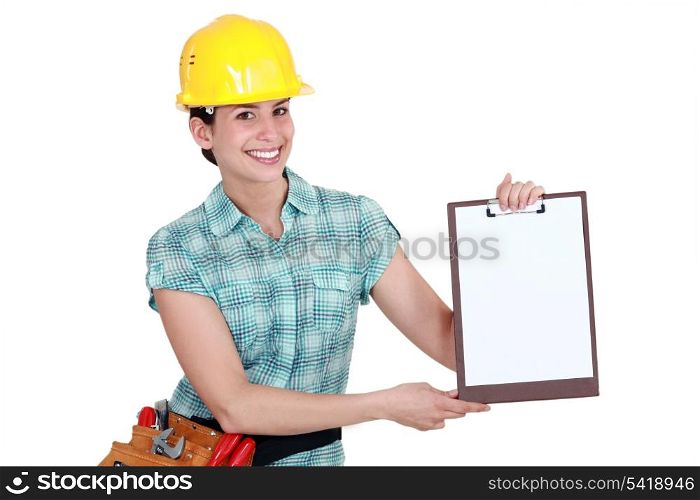 Woman pointing to clip-board