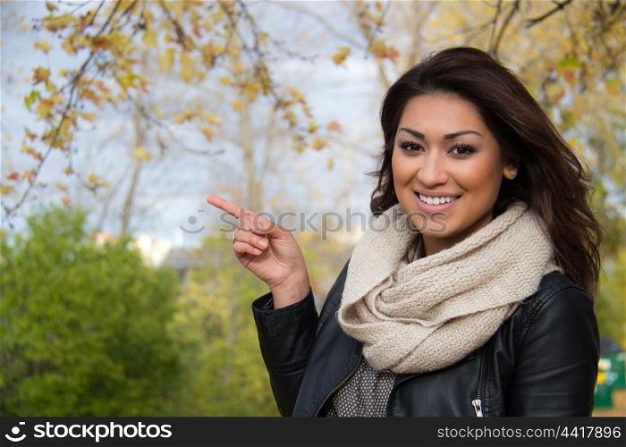 Woman pointing to copy space