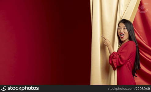 woman pointing while posing chinese new year