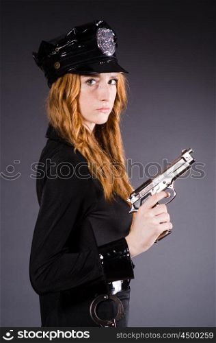 Woman police office with gun