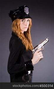 Woman police office with gun