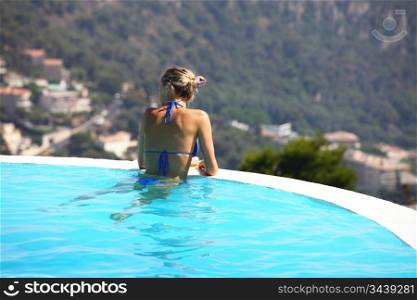 woman portrait in swimming pool