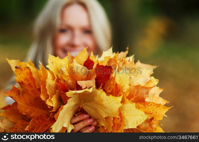 woman portret in autumn leaf close up